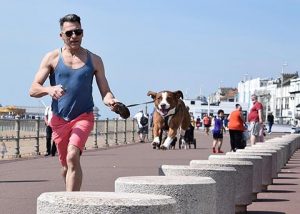 dog walker running with a dog